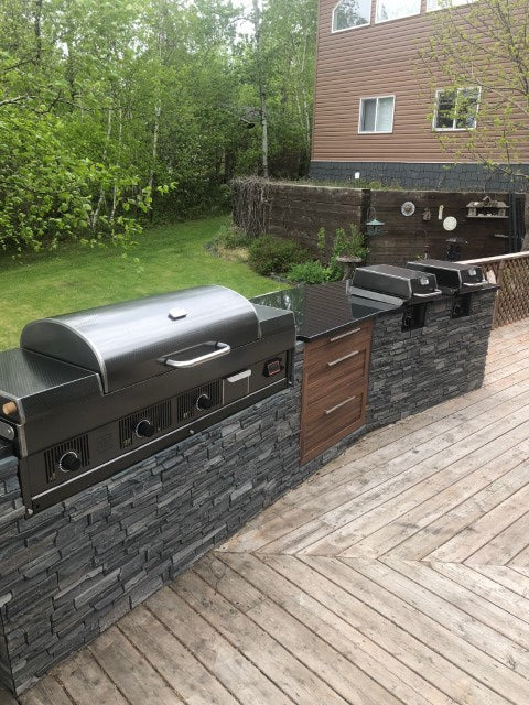 Load image into Gallery viewer, Outdoor kitchen with barbecue grill on a wooden deck
